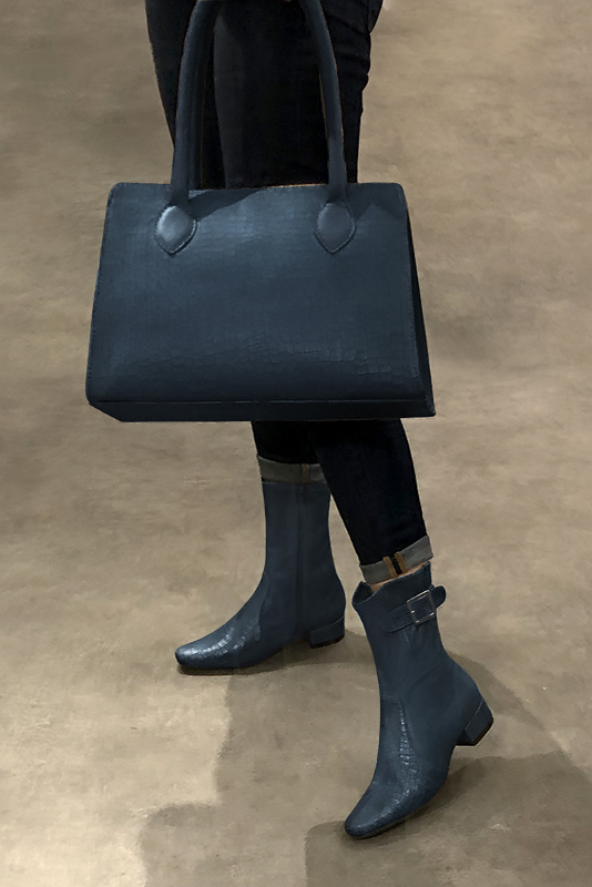 Denim blue women's ankle boots with buckles on the sides. Round toe. Low block heels. Worn view - Florence KOOIJMAN